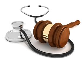 Judge wooden brass gavel with stethoscope healthcare reform